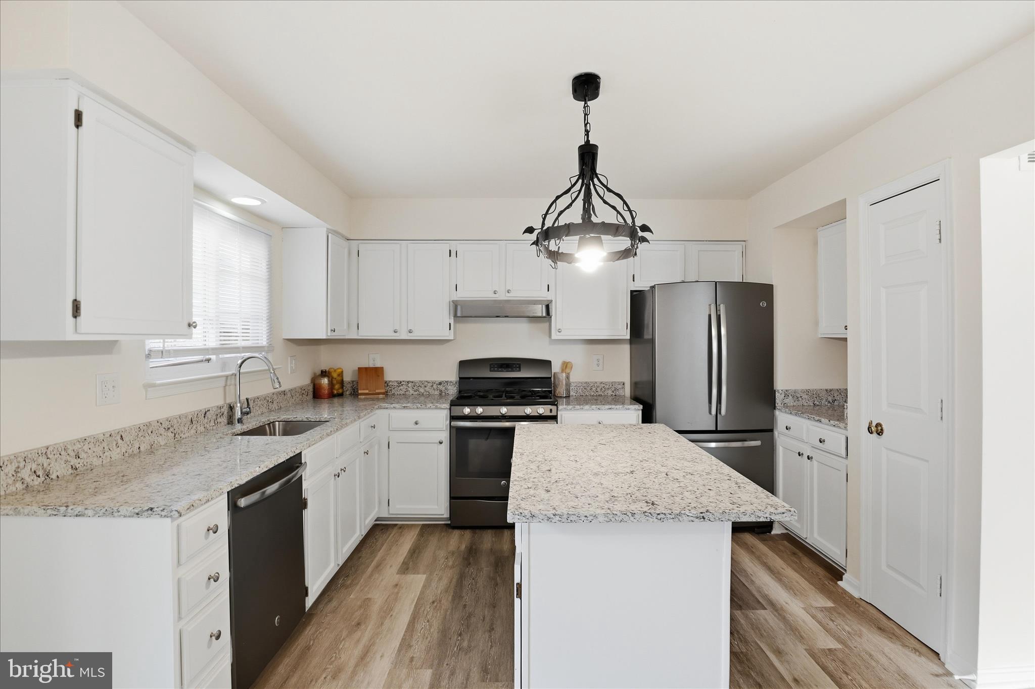 11301 Kessler Place Manassas, VA 20109 - Photo 15 of 52 a kitchen with stainless steel appliances granite countertop a sink refrigerator and cabinets