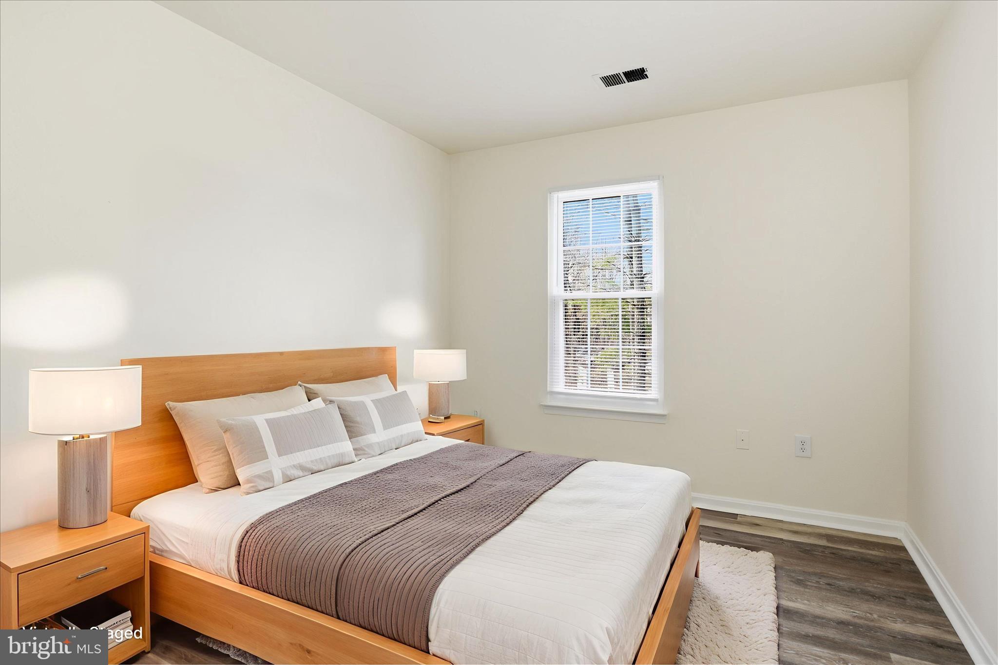 11301 Kessler Place Manassas, VA 20109 - Photo 29 of 52 a bedroom with a bed and a window
