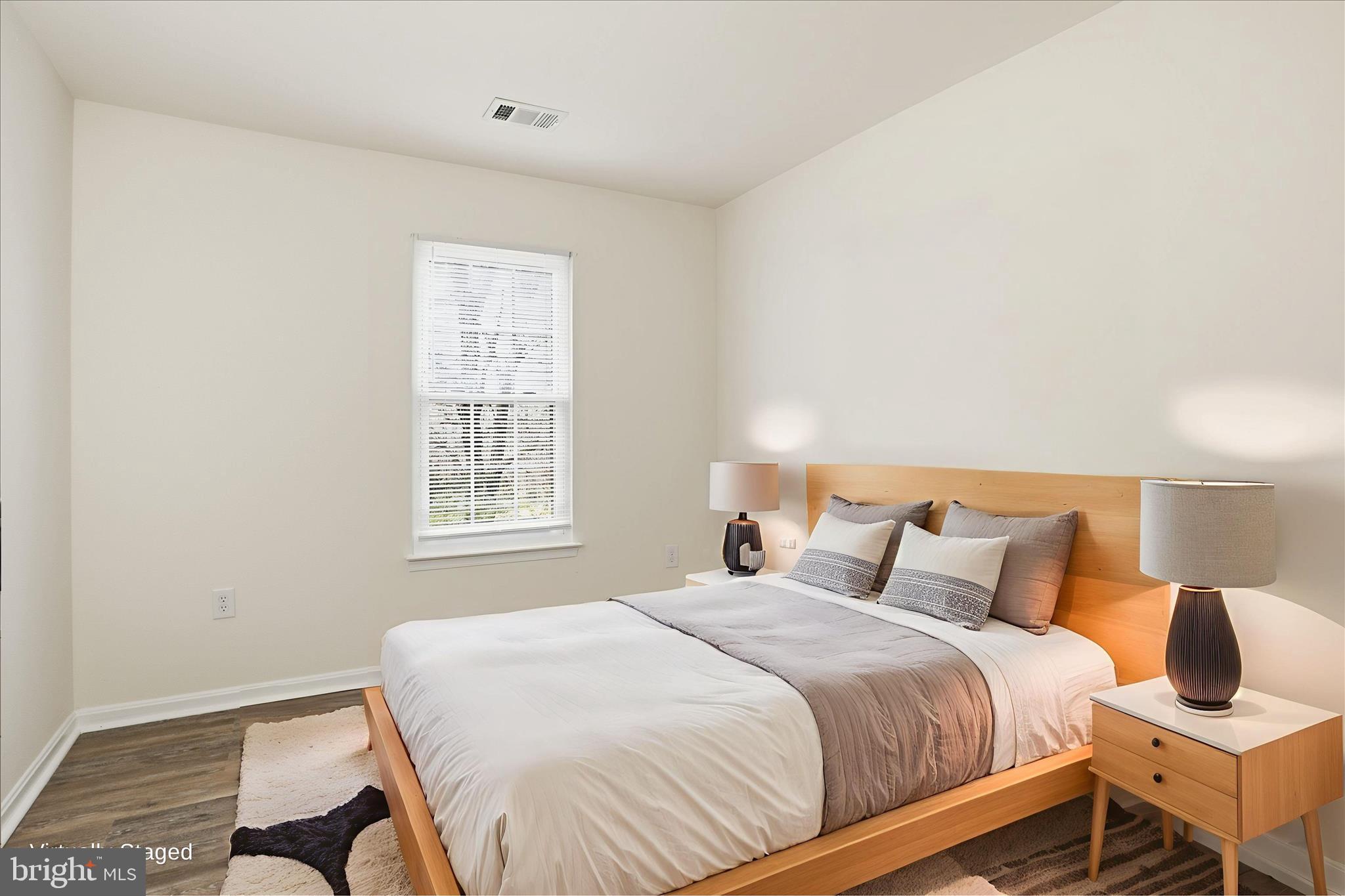 11301 Kessler Place Manassas, VA 20109 - Photo 32 of 52 a bedroom with a bed and wooden floor