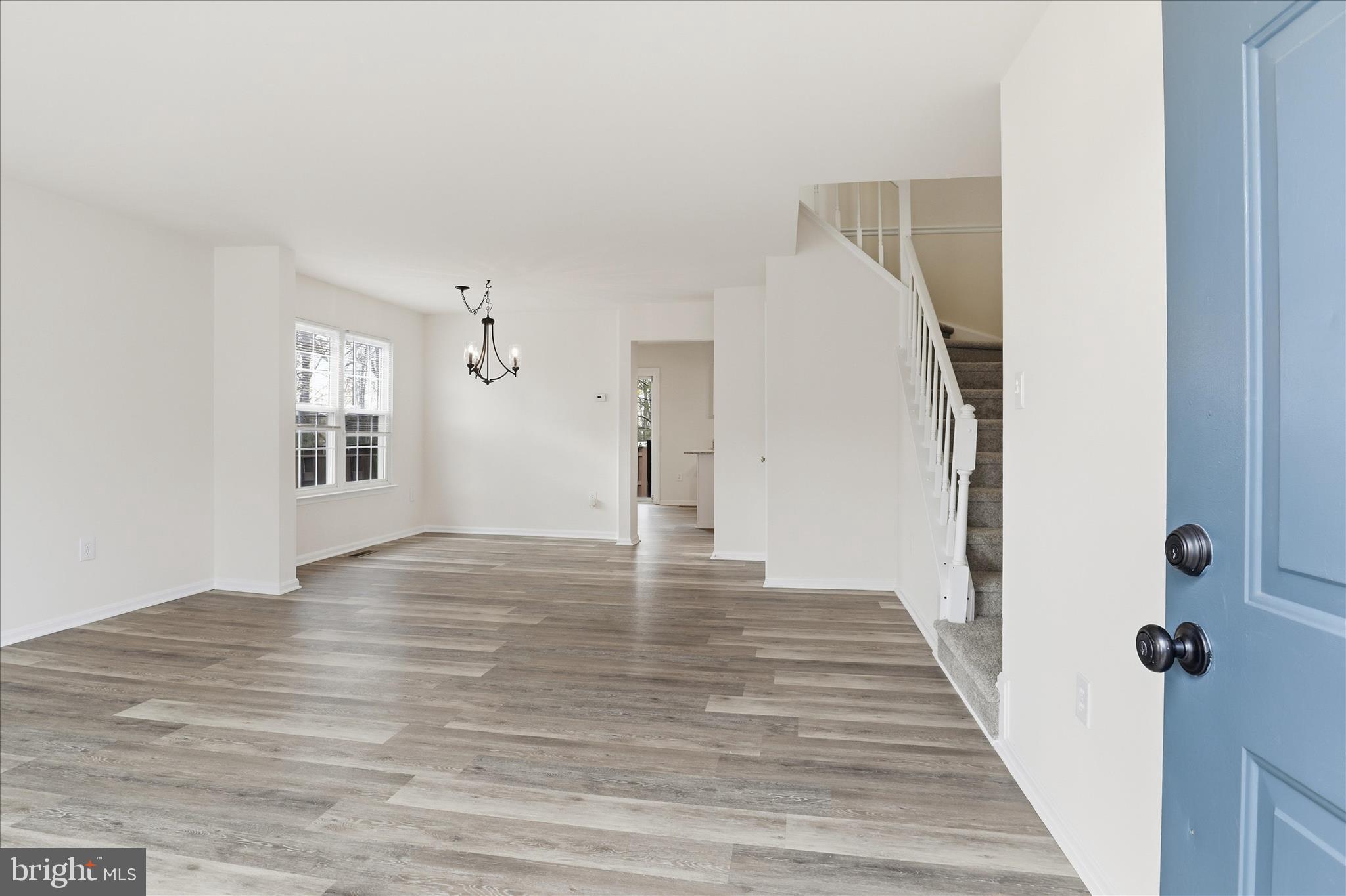 11301 Kessler Place Manassas, VA 20109 - Photo 6 of 52 a view of a hallway with wooden floor and staircase