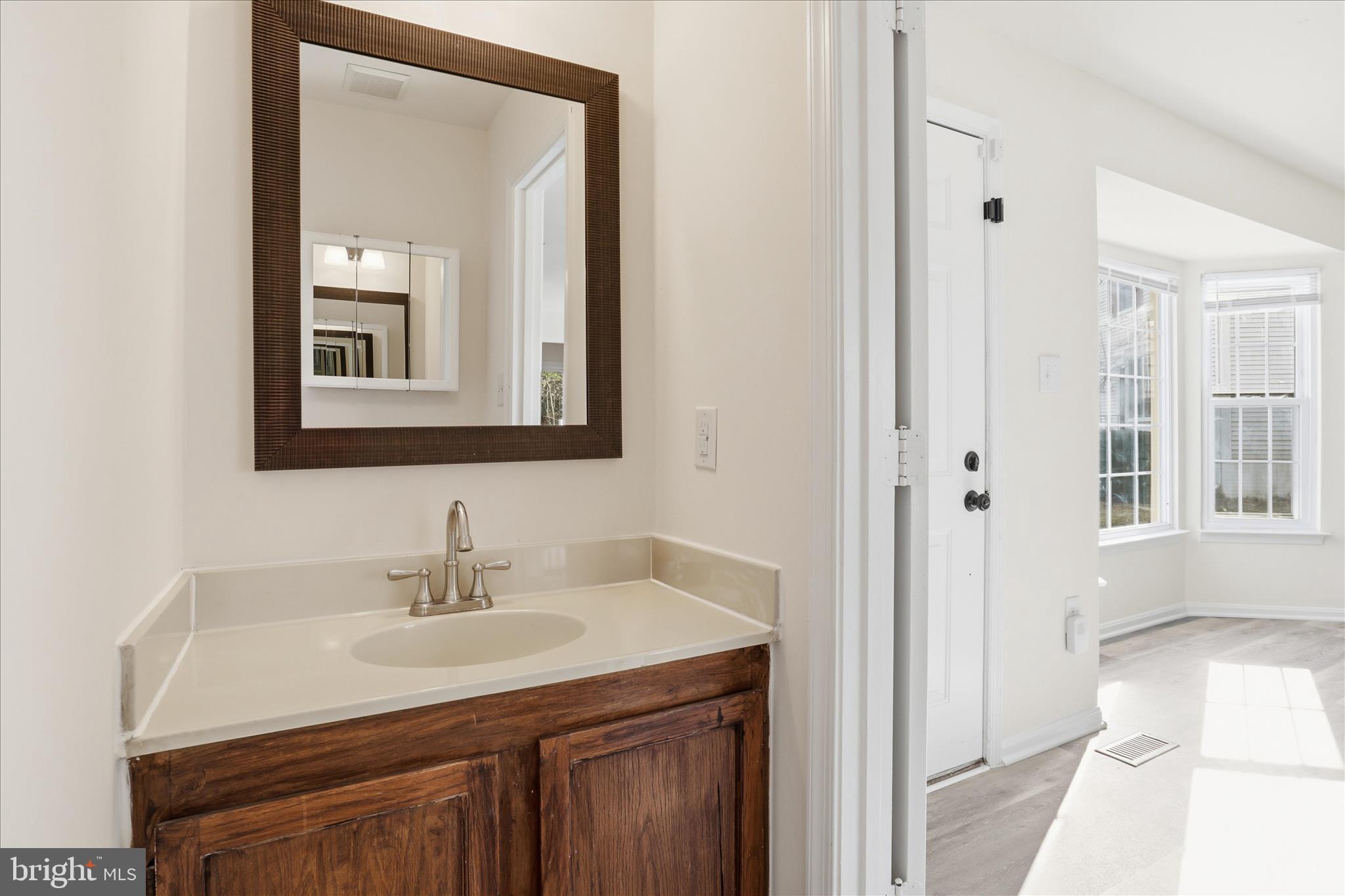 11301 Kessler Place Manassas, VA 20109 - Photo 7 of 52 a bathroom with a sink vanity and a mirror