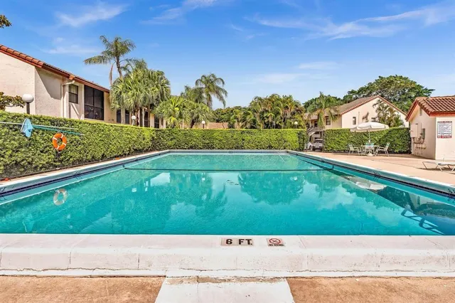 a view of a swimming pool with a patio