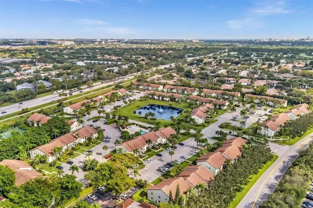 an aerial view of residential houses with outdoor space