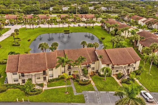 an aerial view of residential building with an outdoor space