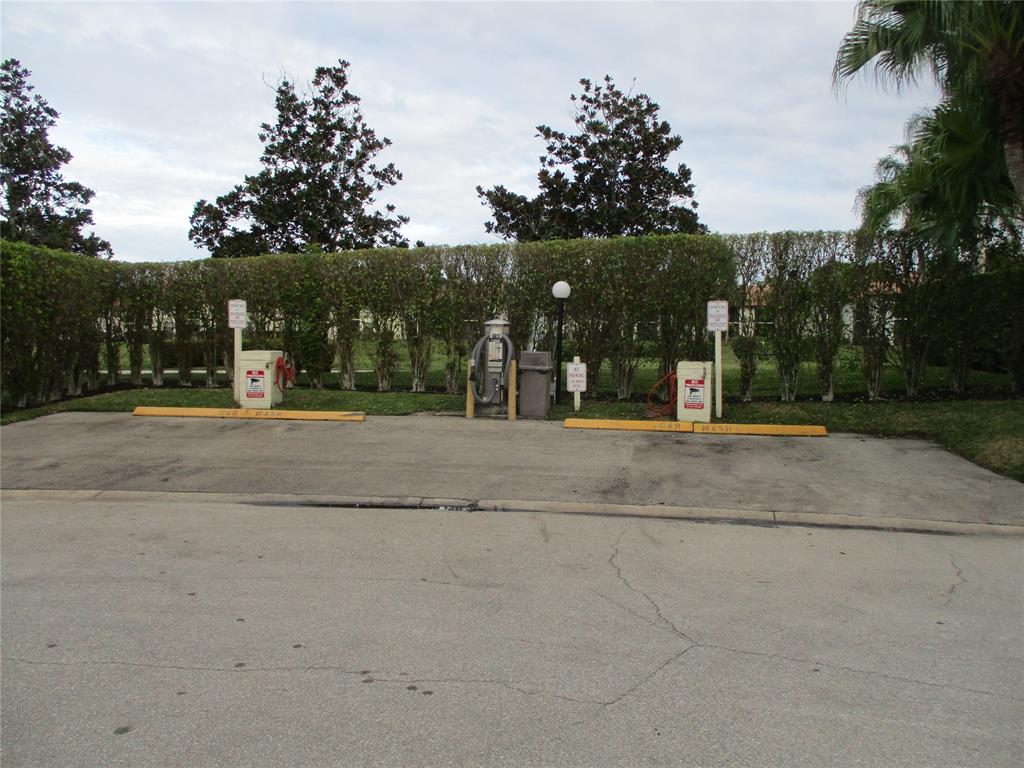 22052 Palms Way, Unit 205 Boca Raton, FL 33433 - Photo 27 of 28 a view of street with basketball court