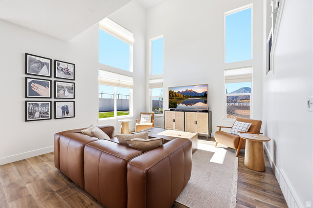 4646 Alder Drive, Unit 223 Mapleton, UT 84664 - Photo 2 of 35 Living area featuring soaring ceilings and abundant natural light