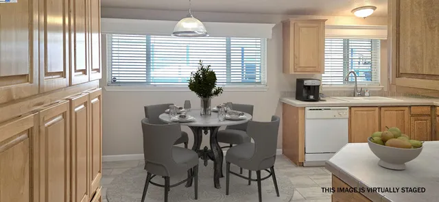 a kitchen with a table and chairs in it