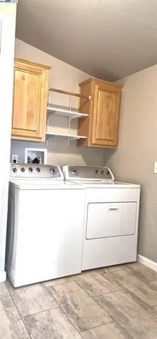 a utility room with washer and dryer