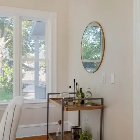 a room with a table and a mirror