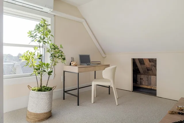 a view of a chairs and table in a room