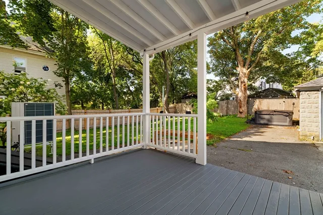 a view of a street with a car park side of road