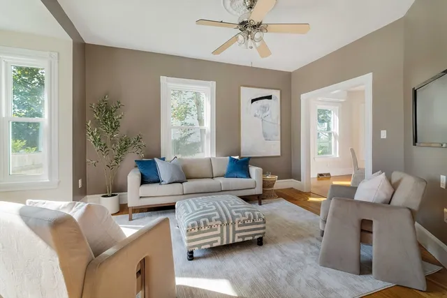 a living room with furniture and a large window