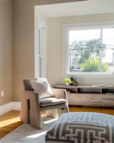 a living room with furniture and a window