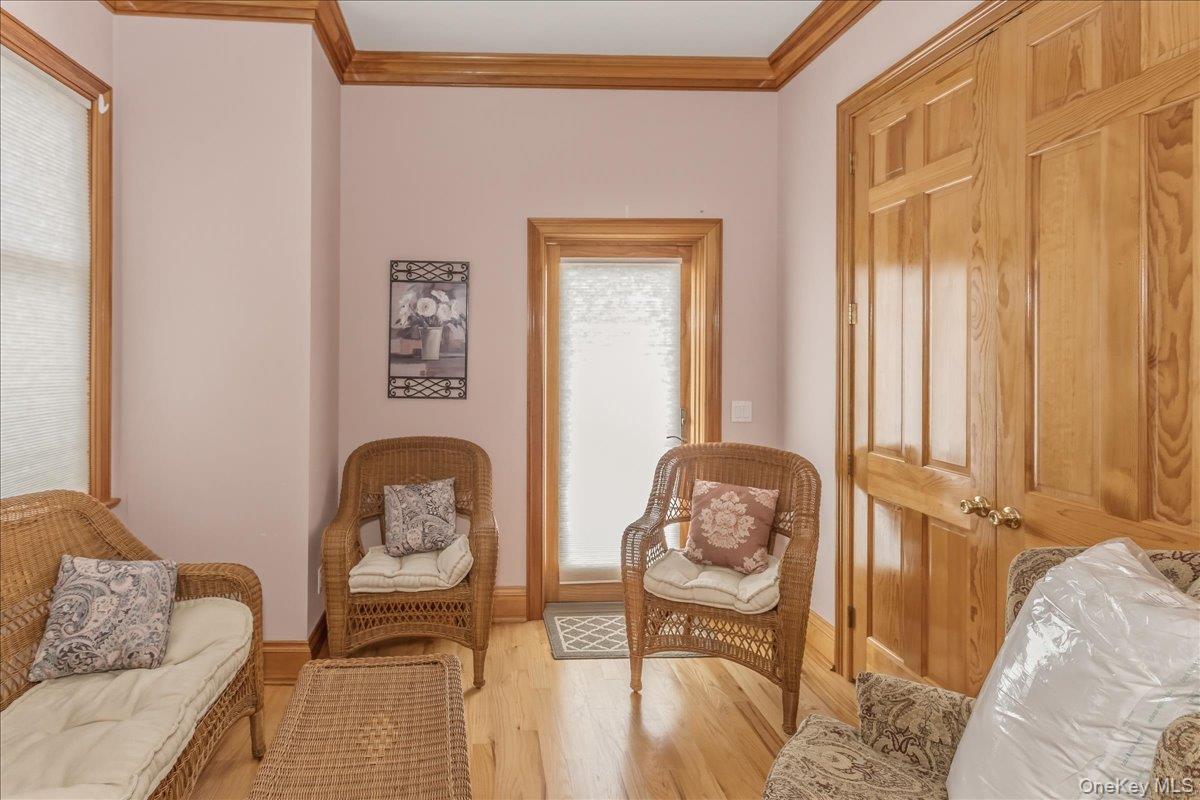 672 Dune Road Westhampton Beach, NY 11978 - Photo 19 of 38 a living room with furniture and a window
