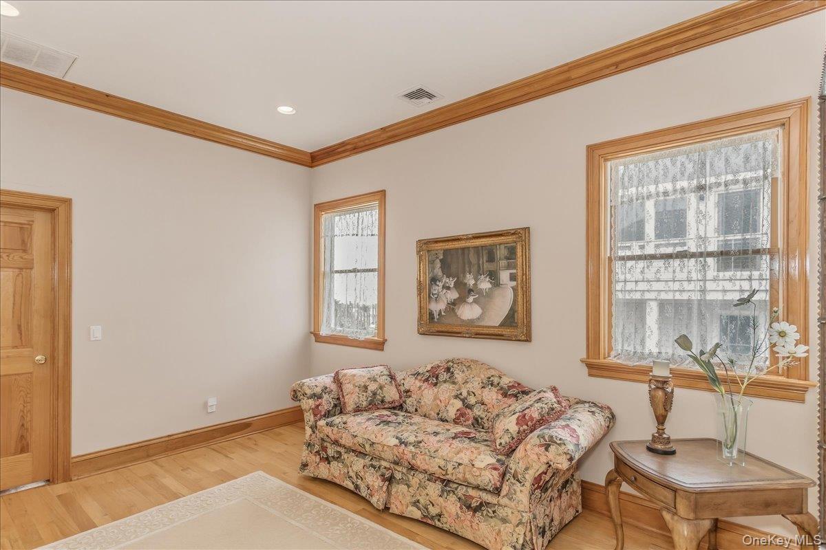 672 Dune Road Westhampton Beach, NY 11978 - Photo 25 of 38 a living room with furniture and a window