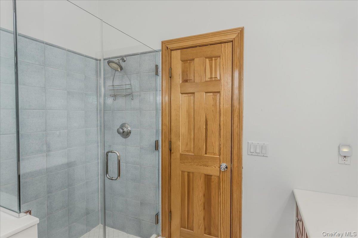 672 Dune Road Westhampton Beach, NY 11978 - Photo 28 of 38 a bathroom with a shower