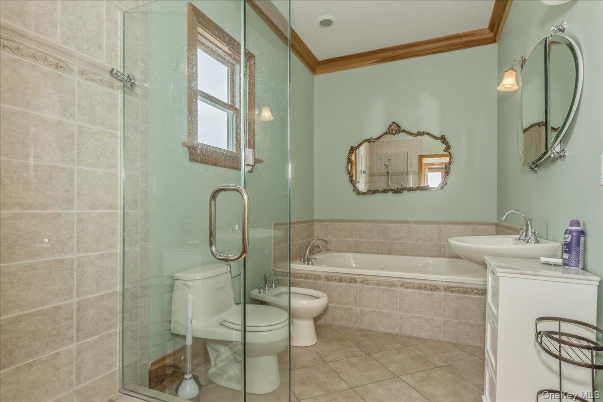 672 Dune Road Westhampton Beach, NY 11978 - Photo 32 of 38 a bathroom with a toilet sink shower and mirror