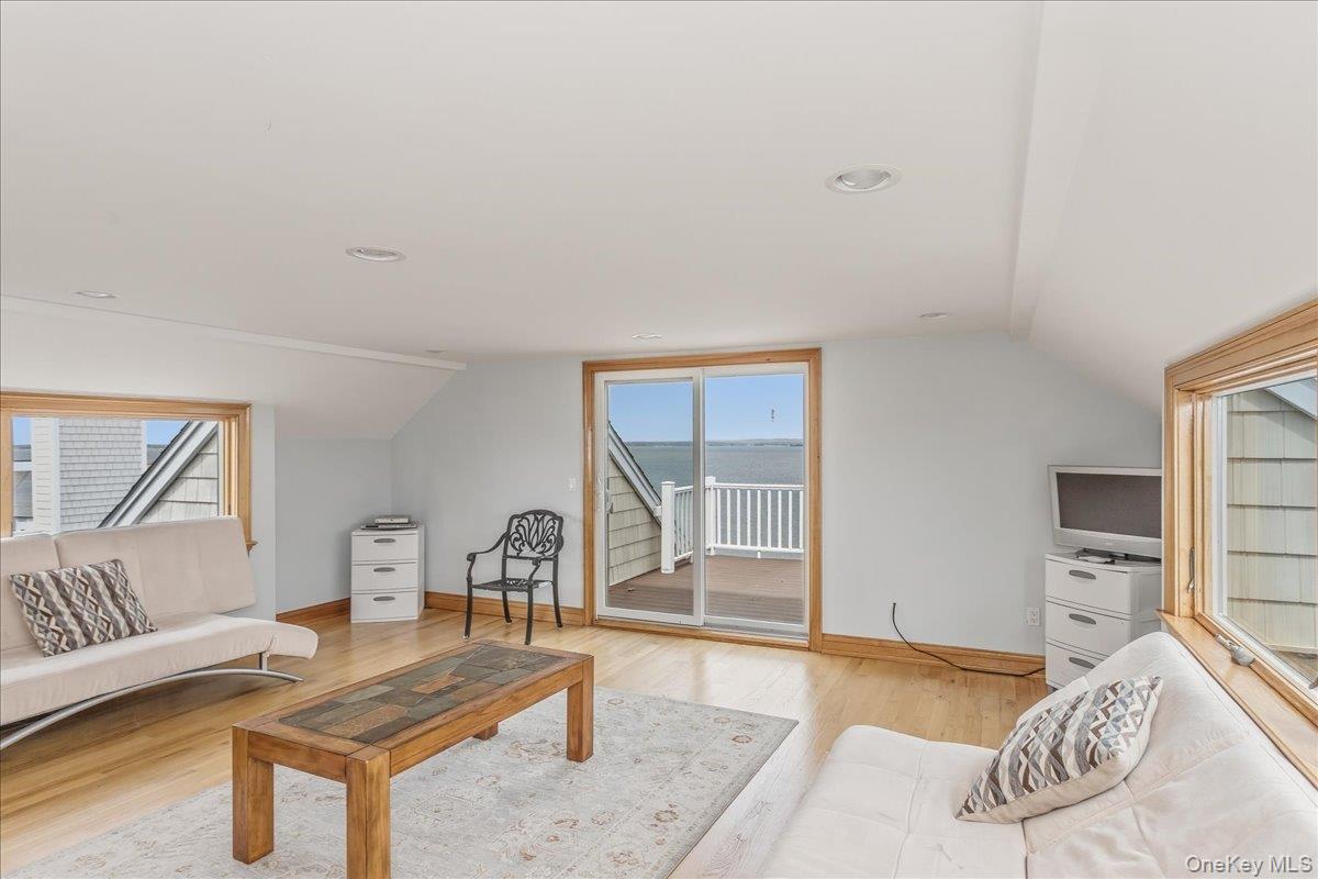 672 Dune Road Westhampton Beach, NY 11978 - Photo 33 of 38 a bedroom with furniture and a window