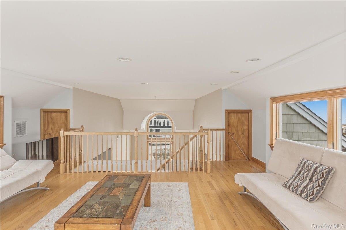 672 Dune Road Westhampton Beach, NY 11978 - Photo 34 of 38 a view of a livingroom with wooden floor and furniture