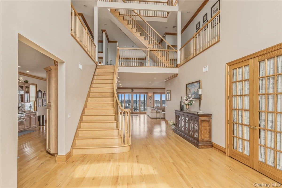 672 Dune Road Westhampton Beach, NY 11978 - Photo 5 of 38 a view of entryway and hall with wooden floor