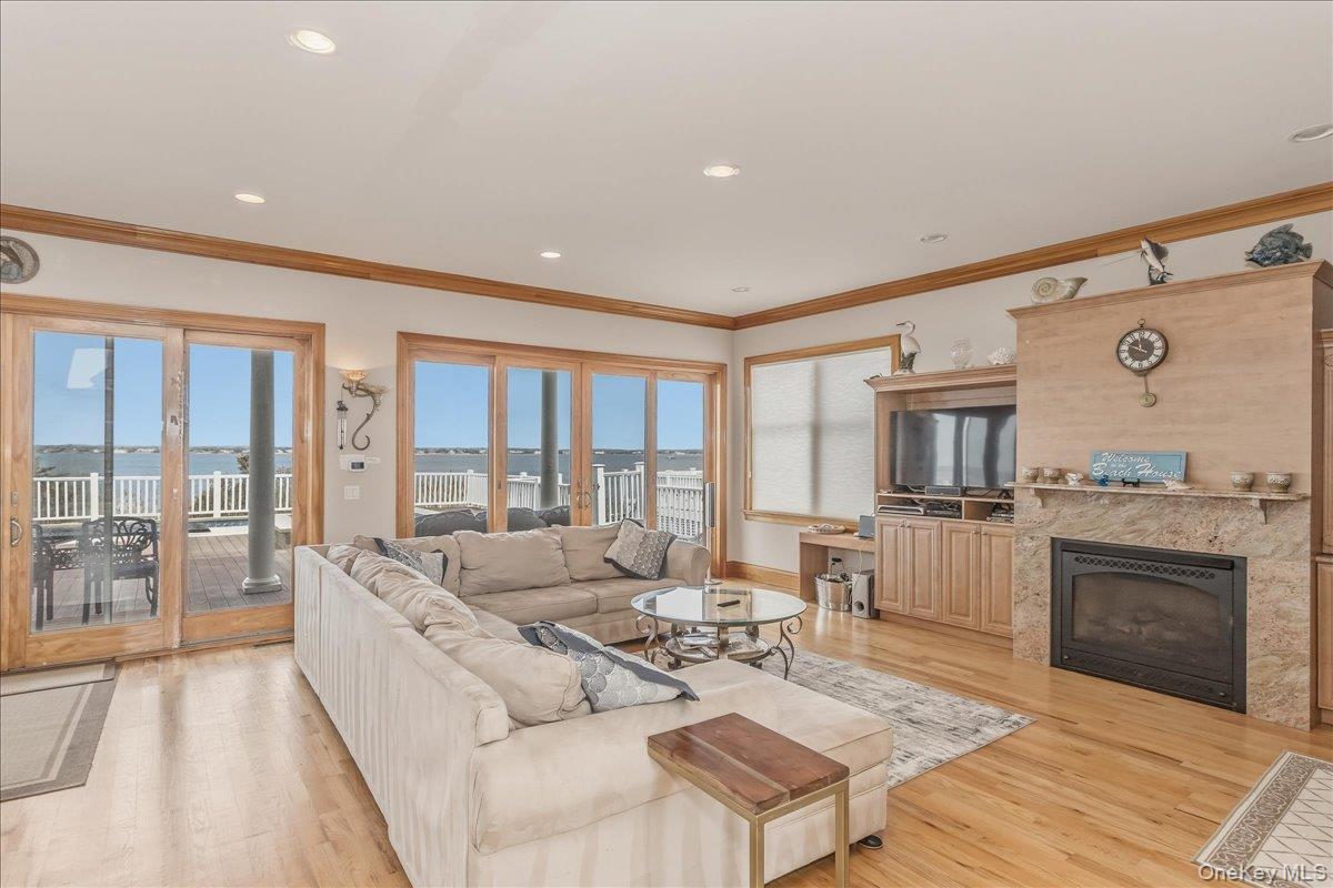 672 Dune Road Westhampton Beach, NY 11978 - Photo 7 of 38 a living room with furniture and a fireplace