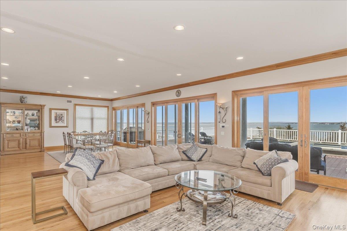 672 Dune Road Westhampton Beach, NY 11978 - Photo 8 of 38 a living room with furniture and a large window