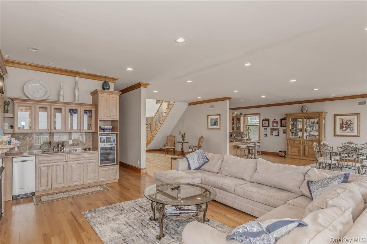 672 Dune Road Westhampton Beach, NY 11978 - Photo 9 of 38 a living room with furniture and view of kitchen