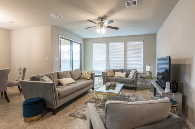 a view of a balcony with chairs and a table