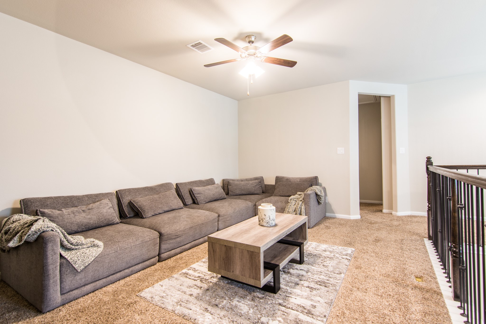 3311 Rainflower Springs Lane Rosenberg, TX 77471 - Photo 21 of 35 a living room with furniture and a chandelier