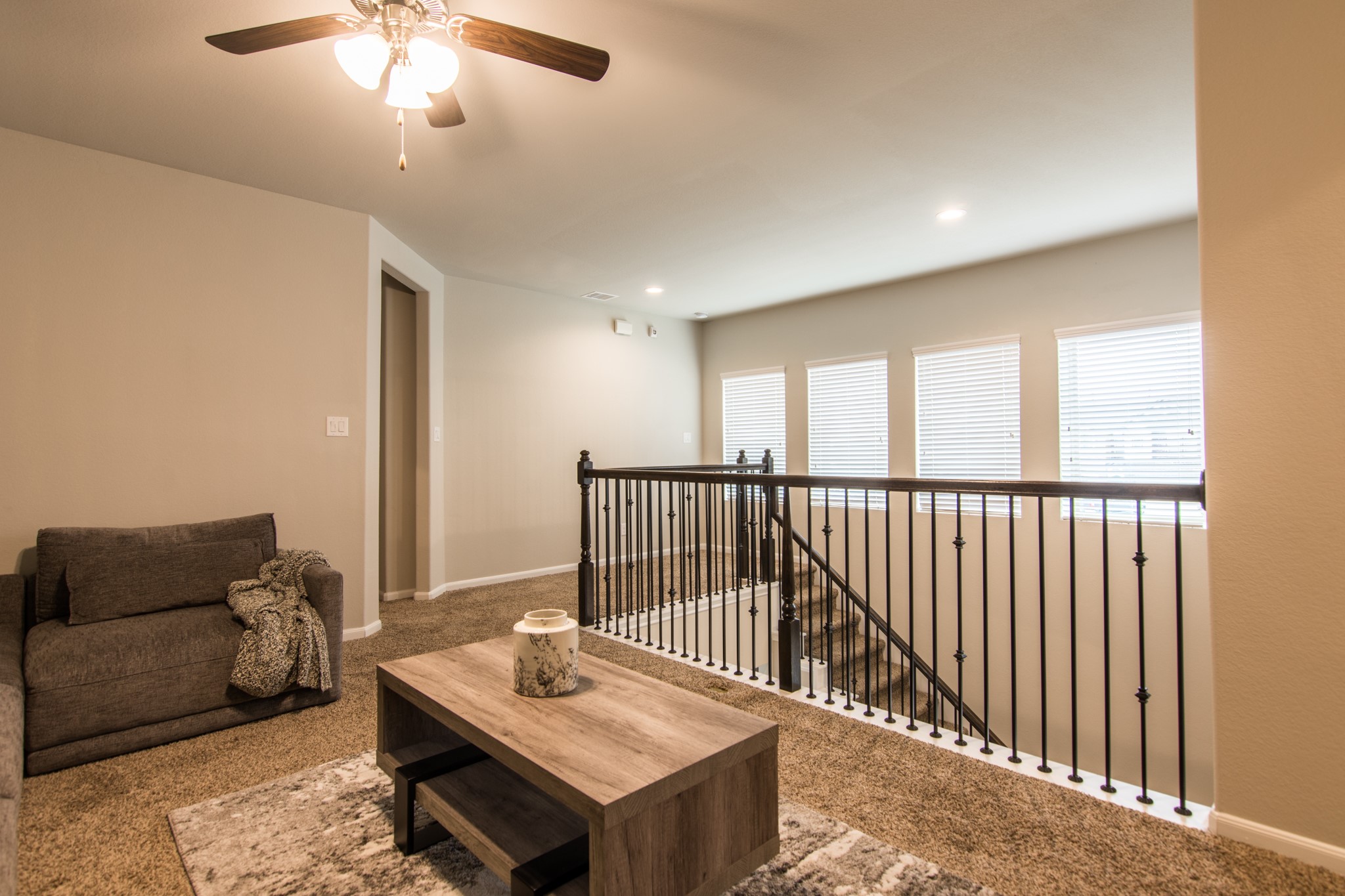 3311 Rainflower Springs Lane Rosenberg, TX 77471 - Photo 22 of 35 a living room with furniture a chandelier and a window