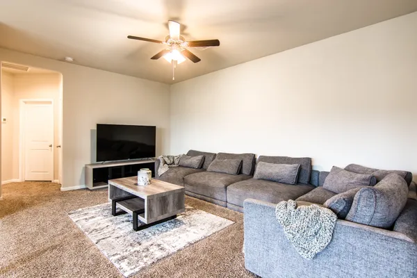 a bed room with a bed and a window