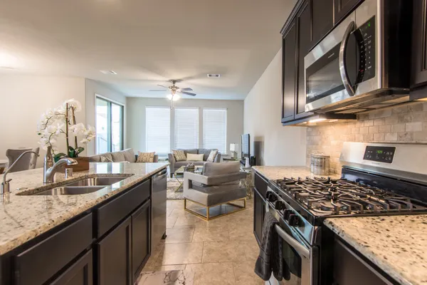 a kitchen with sink and center island
