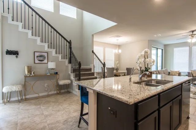 a kitchen with a sink stove and cabinets