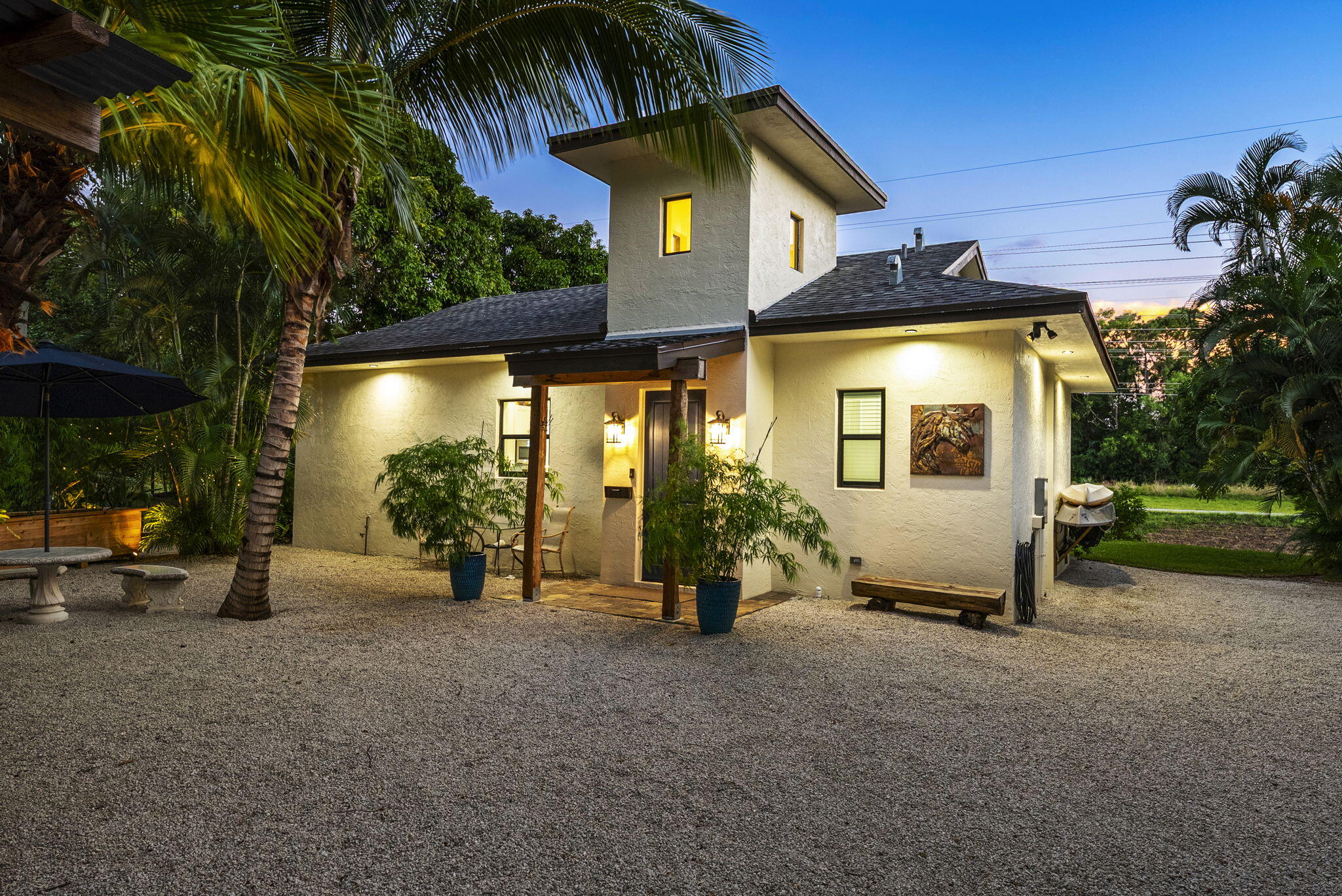 12466 Quercus Lane, Unit GUEST HOUSE Wellington, FL 33414 - Photo 1 of 24 a view of a house with a patio