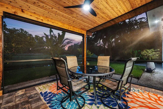 a view of a chairs and tables in patio