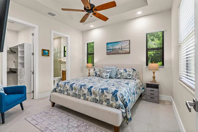 a bedroom with a bed couch and window