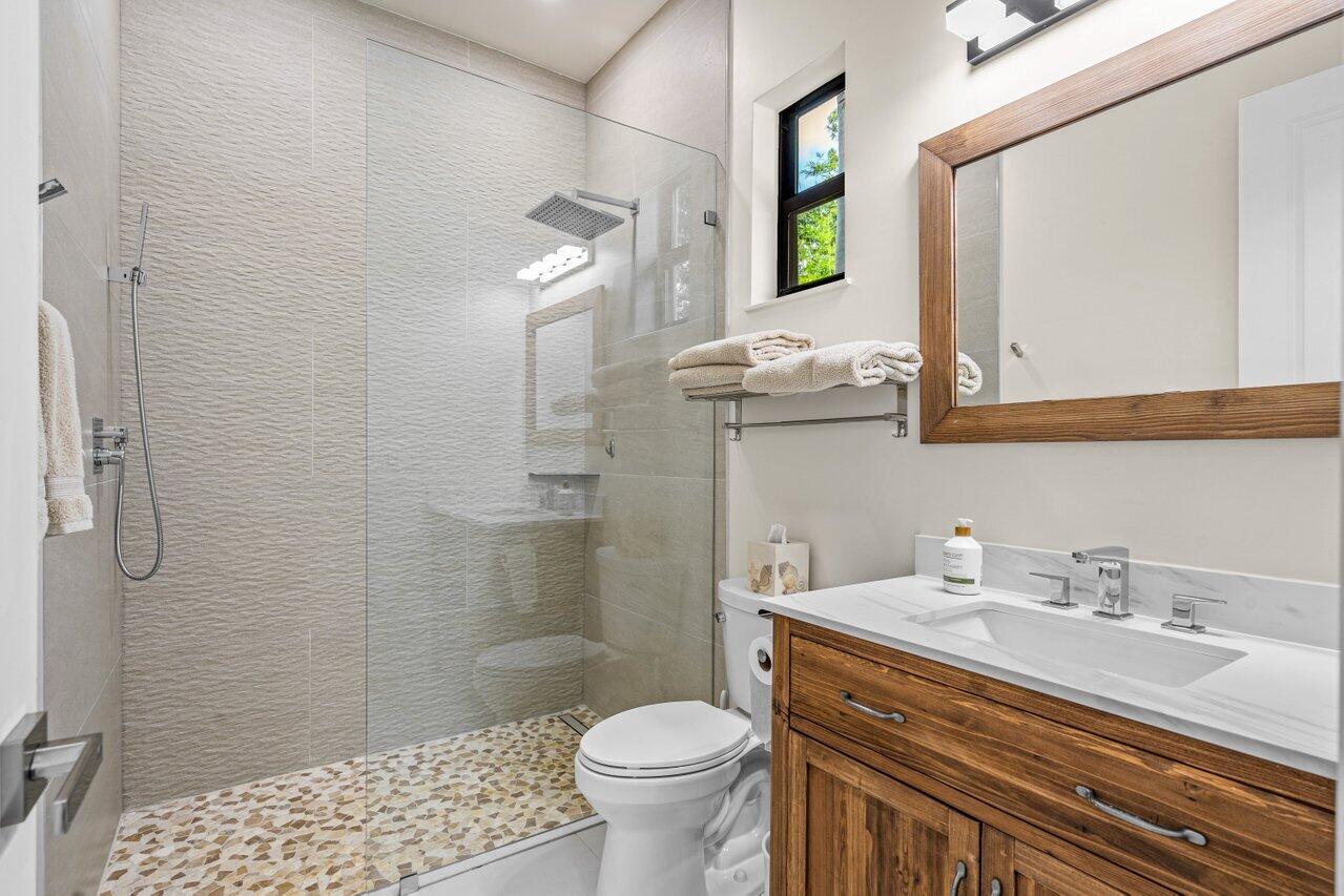 12466 Quercus Lane, Unit GUEST HOUSE Wellington, FL 33414 - Photo 9 of 24 a bathroom with a sink toilet and shower