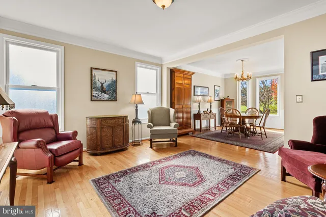 a living room with furniture and a table