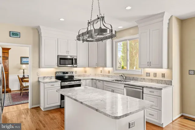 a bathroom with a tub a sink and a shower