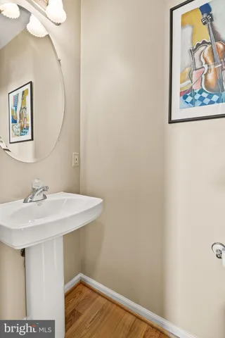 a view of a deck with wooden floor and fence next to a yard