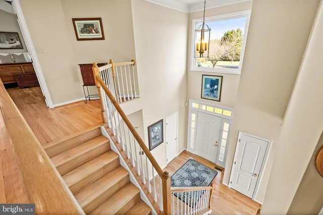 a view of a yard with wooden fence