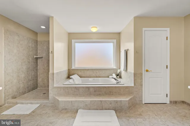 an aerial view of a house with a ocean view