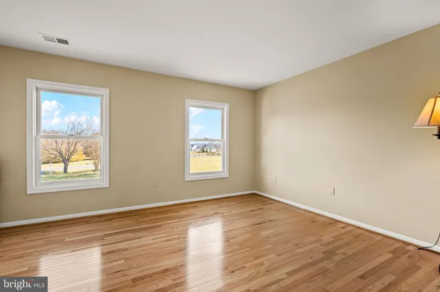 front view of a brick house with a large windows