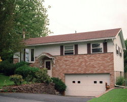 156 El Reno Avenue Nazareth, PA 18064 - Photo 1 of 1 a front view of a house with plants and garage