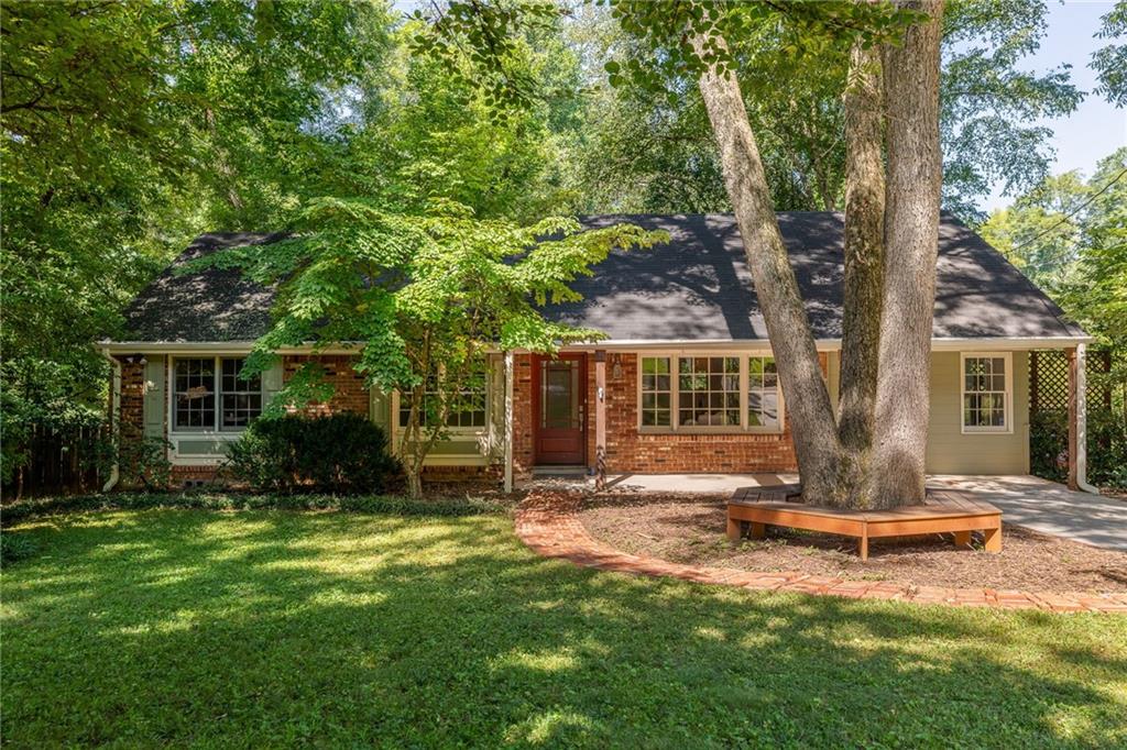 1161 North Carter Road Decatur, GA 30030 - Photo 1 of 1 a view of a backyard with table and chairs and large tree