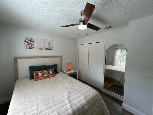 a bedroom with a bed and a fireplace