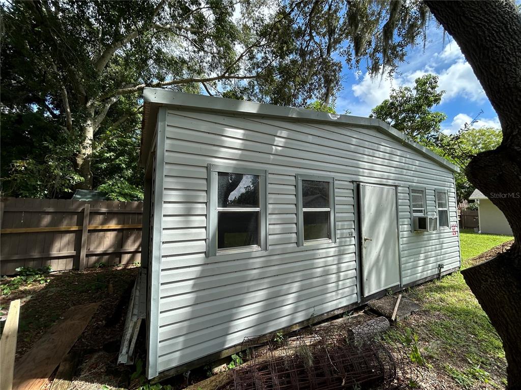 3926 Greenview Pines Court Orlando, FL 32817 - Photo 21 of 28 a view of a house with a yard