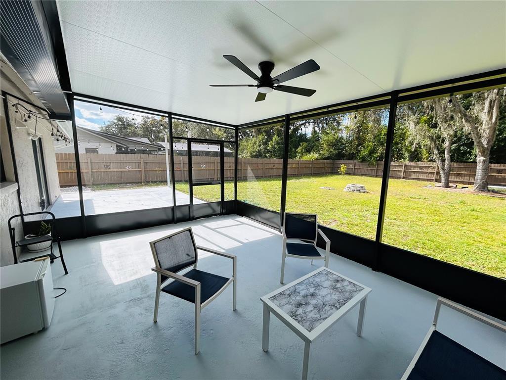 3926 Greenview Pines Court Orlando, FL 32817 - Photo 24 of 28 a living room with couch and a table
