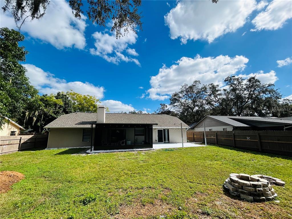 3926 Greenview Pines Court Orlando, FL 32817 - Photo 27 of 28 a front view of a house with garden