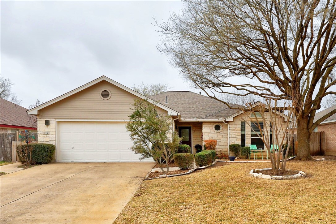 a view of a house with a yard covered in snow